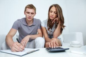 young couple working on budget